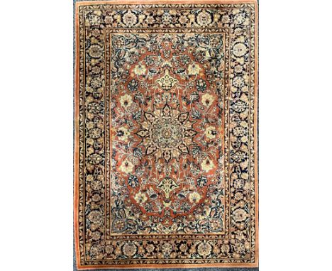 A rectangular wool rug or carpet, in the Persian Tabriz taste, 182cm x 124cm