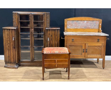 An Art Deco design oak bookcase, 121.5cm high, 122cm wide, 37.5cm deep; an Arts &amp; Crafts period oak marble top washstand;