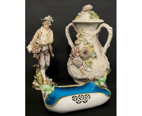 A Mintons dish, the pierced scrolling rim with gilt edging, mounted with a pair of English garden birds, blue interior, 22.5c