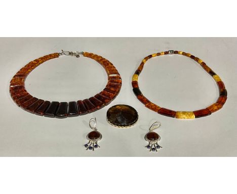 A 925 silver and amber necklace, 40cm long; another similar; ear-rings en suite; an associated brooch (4)