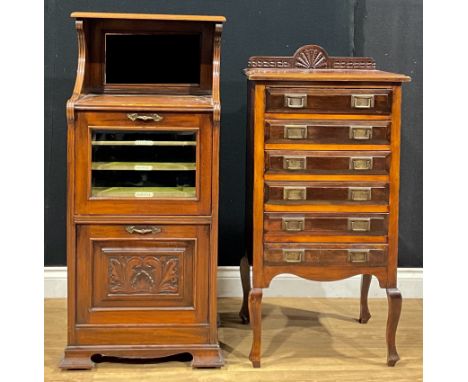 An early 20th century walnut and mahogany music room pier cabinet, 111cm high, 51.5cm wide, 40cm deep; a sheet music filing c