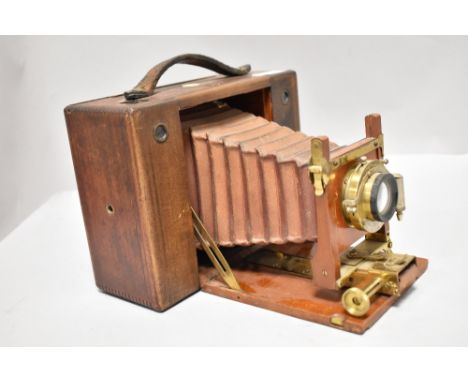 A Cartridge Kodak No4 4x5 format camera in wooden case with red bellows