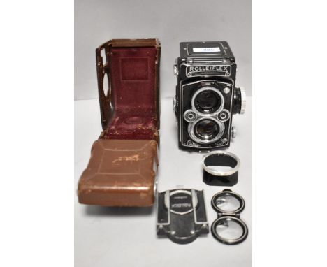 A Rolleiflex Reflex camera with Carl Zeiss Planer 75mm f3,5 lens in leather cover