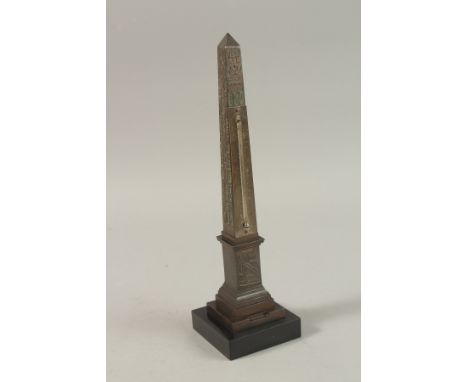 A GRAND TOUR BRONZE OBELISK BAROMETER on a stepped base. 30cms high.
