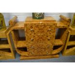 A STYLISH ART DECO BURR WOOD SIDE UNIT with four central drawers flanked by open shelves.