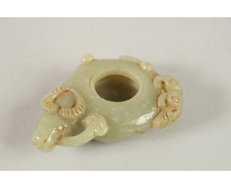 A CARVED JADE BRUSH WASHER.