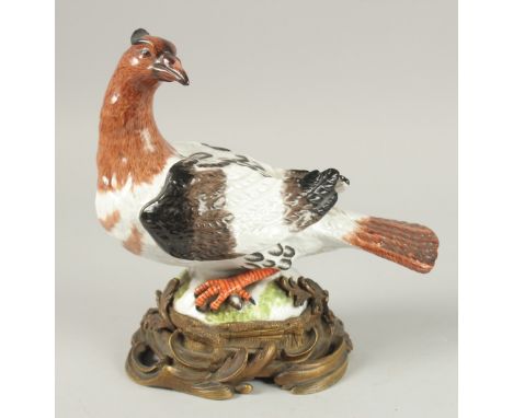 A, POSSIBLY MEISSEN, PORCELAIN BIRD on an ormolu base. 22cm high x 23 cm long.