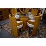 A GOOD ART DECO STYLE DINING SUITE COMPRISING A PEDESTAL GLASS TOP TABLE with a set of four burr