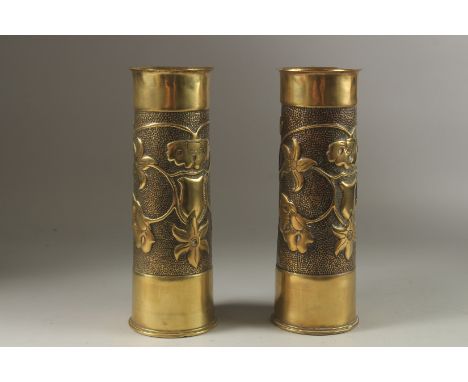A PAIR OF FIRST WORLD WAR TRENCH ART BRASS SHELL CASES. 30cms high.