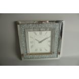 A SQUARE MIRRORED WALL CLOCK. 50cm