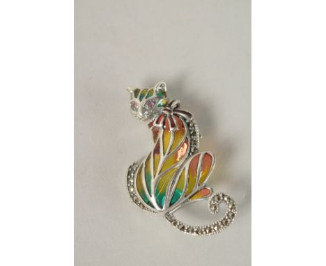A SILVER PLIQUE ENAMEL CAT BROOCH with ruby eyes.