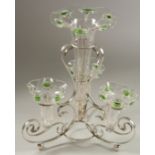 AN ART NOUVEAU COLUMN GLASS TABLE CENTREPIECE with a silver plated stand and four trumpet vases.