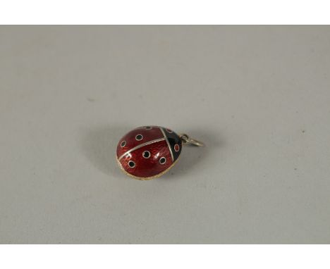 A SILVER AND ENAMEL LADYBIRD EGG PENDANT.