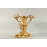 A GOOD ORMOLU TWO HANDLED URN with acanthus and scroll mounts.