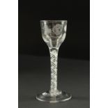 A GOOD GEORGIAN ENGRAVED CORDIAL GLASS with air twist stem.