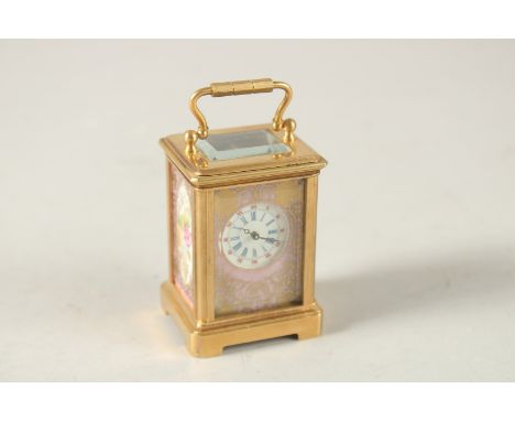 A MINI SEVRES CARRIAGE CLOCK. 6cms high.