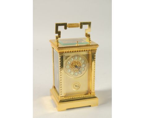 A GOOD FRENCH GILT CARRIAGE CLOCK with repeat action and alarm. 15cms high.