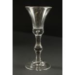 A GOOD GEORGIAN WINE GLASS with baluster stem.