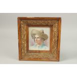 A PORCELAIN PLAQUE "Head and shoulders". Marked P. H. 13cm x 12cm in a gilt frame.