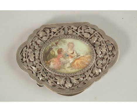 A FRENCH SILVER SHAPED COMPACT, the top inset with a miniature. 10cms long x 7cms wide. 110grms.