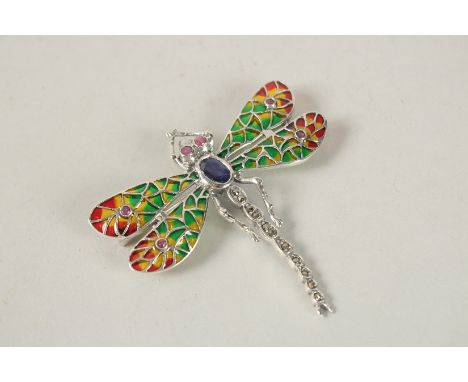 A SILVER AND PLIQUE ENAMEL SAPPHIRE SET DRAGONFLY BROOCH.
