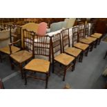 A GOOD MATCHED SET OF TWELVE LANCASHIRE SPINDLE BACK ASH AND RUSH SEATED DINING CHAIRS, two with
