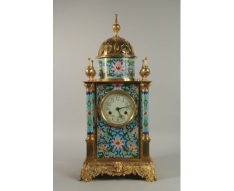 A LARGE LOUIS XVITH STYLE BRASS ENAMEL CLOCK with domed top, column sides and ornate brass base. 72cm high.