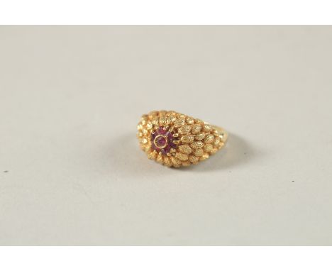 AN 18CT YELLOW GOLD AND RUBY CLUSTER RING. Ring size (K 0.5).