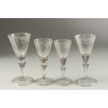 FOUR ENGRAVED WINE GLASSES on folded foot. 17cm (1), 16cm (1) & 15cm (2).