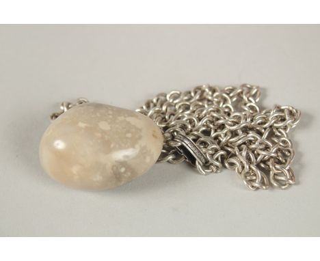 A HERMES JADE EGG PENDANT on a silver chain, stamped HERMES, PARIS.