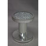 A TWO TIER CIRCULAR MIRRORED TABLE. 50cm diameter 60cm high.