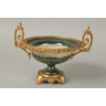 A CONTINENTAL PORCELAIN AND GILT METAL TWO HANDLED BOWL painted with flowers. 17sm diameter.