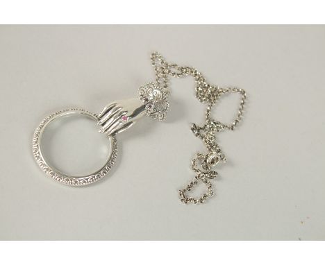 A SILVER HAND RUBY SET MAGNIFYING LOUPE.