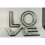 FOUR LARGE MIRRORED LETTERS "LOVE".