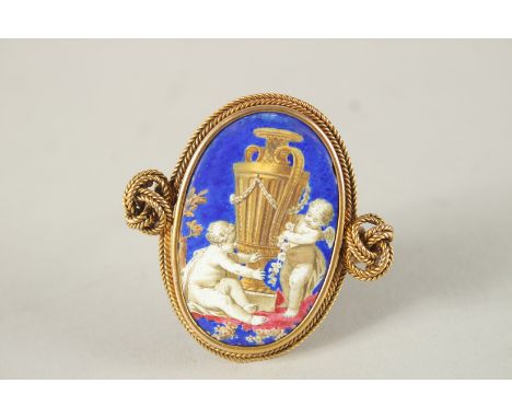 A SUPERB VICTORIAN 18CT GOLD AND ENAMEL CHERUB BROOCH.