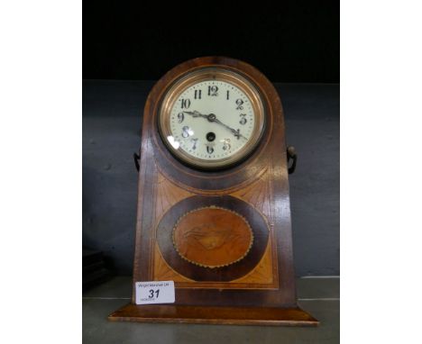 A late 19th/early 20th Century mahogany cased domed topped mantel clock with inlaid panel to front 