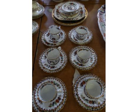 A Spode Chinese Rose pattern part tea set together with two Falcon ware gilt decorated plates.