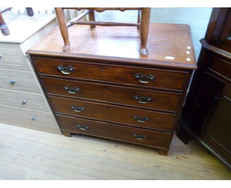 A late Georgian mahogany chest of four graduated drawers of brass handles raised on bracket feet 
