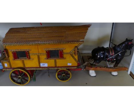 A scratch built gypsy caravan with ceramic horse