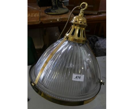 A modern metal framed and ribbed glass hanging ceiling light fitting 