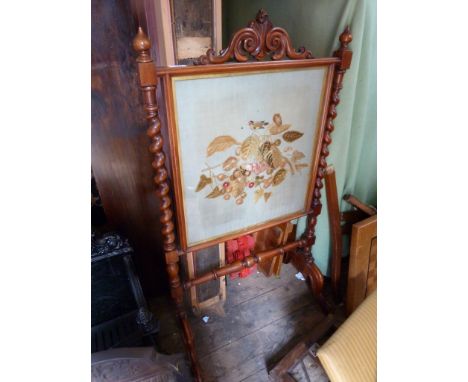 A 19th Century mahogany framed fire screen with tapestry panel depicting a bird and foliage, with spindle sides.   CONDITION 
