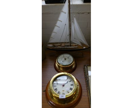 A modern brass cased aneroid barometer and similar wall clock together with a model yacht (3) 