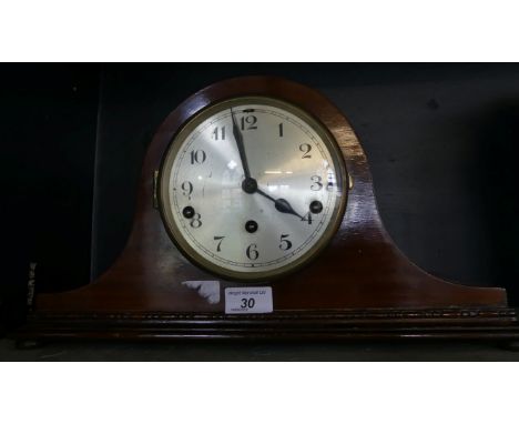 A mahogany cased domed top mantel clock.
