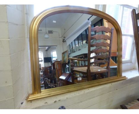 A gilt framed over mantel mirror
