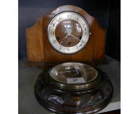 An Art Deco period walnut veneered mantel clock together with a further aneroid barometer in carved case (2)