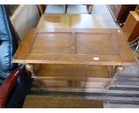 An early 20th Century light oak monks bench, having hinged seat enclosing storage compartment.   CONDITION REPORT:  back supp