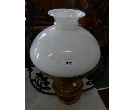 A 20th Century hanging ceiling oil lamp with opaque vesta glass shade and amber glass font 
