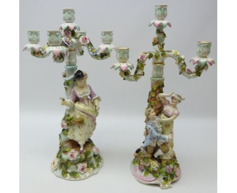 Sitzendorf matching pair of porcelain candelabra, four light and five light, one decorated with a lady holding a rose and the