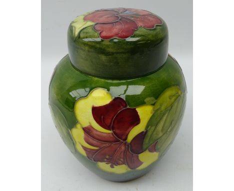 Moorcroft Hibiscus pattern ginger jar and cover on green ground, green signature and original label, H16cm  Condition Report 