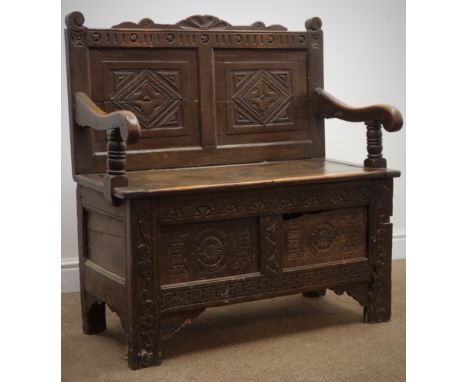 Oak Monks bench with lozenge carved panel back, lifting seat and roundel carved front, W90, H96cm, D46cm Condition Report Inc